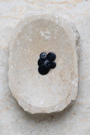 Another close-up of the buttons on the marbled beige stone, from a different angle.