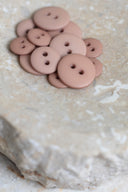 Another close-up of the buttons on the marbled beige stone, from a different angle.