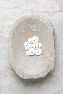 Another close-up of the buttons on the marbled beige stone, from a different angle.
