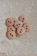 Another close-up of the buttons on the marbled beige stone, from a different angle.