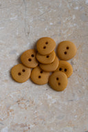 Another close-up of the buttons on the marbled beige stone, from a different angle.