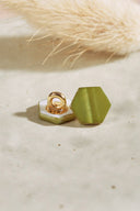 Close-up of the buttons shown from the back, revealing the gold metal shank fastening.