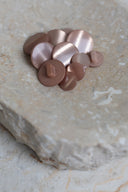 Another close-up of the buttons on the marbled beige stone, from a different angle.