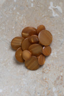 Another close-up of the buttons on the marbled beige stone, from a different angle.