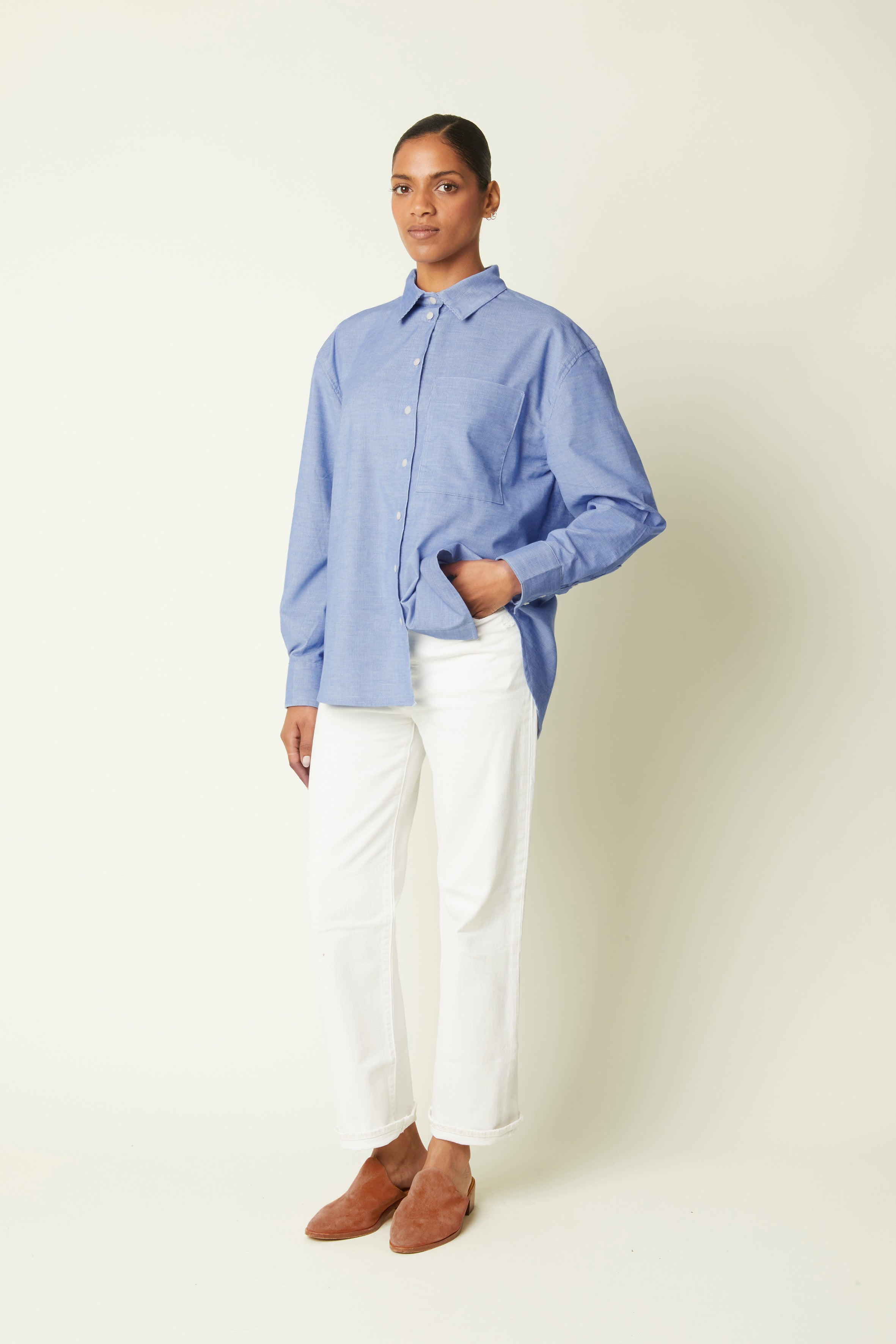 Boyish Shirt pattern – front view, oversized blue chambray shirt, white trousers, camel mules – Atelier Brunette