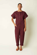 Jumpsuit pattern – Front view, burgundy jumpsuit, loose sleeves, button placket, elasticated waistband – Atelier Brunette