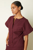 Jumpsuit pattern – 3/4 bust view, burgundy jumpsuit, button placket, earring – Atelier Brunette