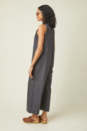 Playsuit pattern – Woman, back view, playsuit charcoal grey V neckline, sleeveless, sunglasses – Atelier Brunette