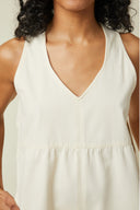 Playsuit pattern – bust shot, playsuit ivory, deep V neckline, gathers at the waist – Atelier Brunette
