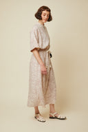 Zipped Dress pattern – portrait front view, dress printed zebra-print colourway sand – Atelier Brunette