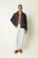 Jacket pattern – front view, jacket indigo denim orange stitching, caramel top, white jeans – Atelier Brunette