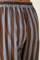 Pyjamas pattern – close-up waist, trousers striped brown and blue, elasticated waistband, coloured nail polish – Atelier Brunette