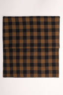 Le Carreau 009 caramel and black fabric with small buffalo-check style checks, folded in half and viewed from above.
