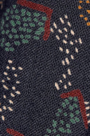 Vue macro de la texture tissée et du motif pointillé du tissu viscose Vera marine foncé.